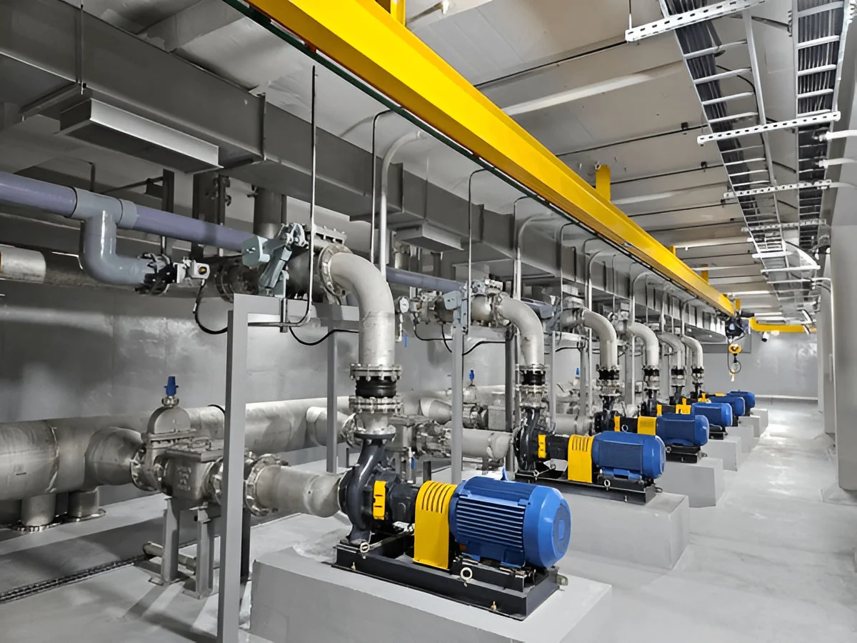 Row of pumps and headers in a clean mechanical room